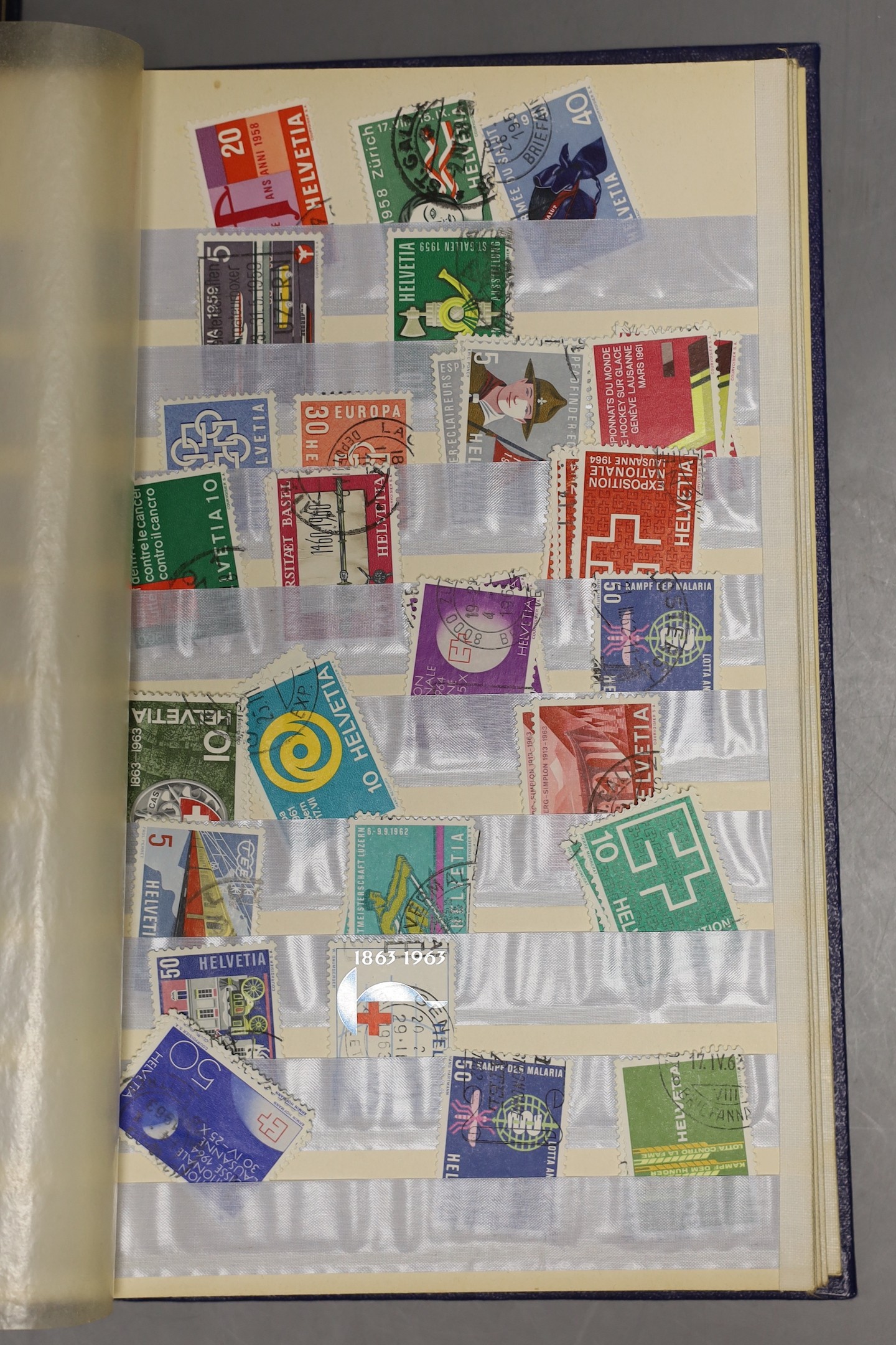Two small stock books British Commonwealth, France mint stamps and packets